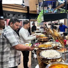 I believe in creating a grand impression. This extensive buffet setup for a corporate event at Häfele showcases our capability to handle large scale gatherings with elegance and an abundance of delicious options.
