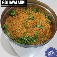 Today's hot breakfast, Gojjavalakki. This tangy and spicy flattened rice dish is a Karnataka delicacy, garnished with fresh coriander before serving.