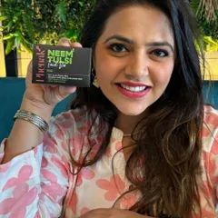 It brings me so much joy to see you rediscovering your natural radiance with my products. Here, a happy customer holds up the Neem Tulsi Facial Bar, a favorite for achieving clear, healthy skin.