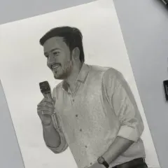A finished A4 sketch of a man speaking into a microphone. I focused on his happy expression and the details of his patterned shirt.