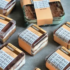 My Classic Italian Tiramisu is available in these convenient tubs and larger trays. Each serving is made with my signature egg-free recipe, featuring pronounced notes of coffee and chocolate for an authentic taste. They are perfect for gifting or personal indulgence.