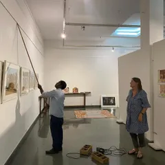 My team and I measuring and leveling artworks for Clare Arni's 'Southern Stars'. Precision and attention to detail are key to creating a professional and visually coherent display.