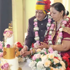 A precious moment from my parents' 50th anniversary celebration, as they cut the three-tier cake I made for them. Being able to create this for them was an incredibly special experience.