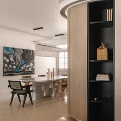 A softly curved wall, a signature element of Kanso House, leads into the dining area. This architectural feature creates a gentle flow and a sense of discovery as you move through the space.