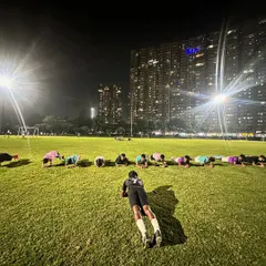 Planks under the floodlights. Core strength and physical conditioning are non-negotiable at our academy. We build athletes, not just football players.
