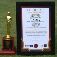 The trophy and certificate from the South India Healthcare Excellence Awards. This award is a testament to the dedication of our entire team and the trust our guests place in us.