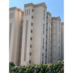 A photo of the nearly completed Love Home Jodhpur building. This image shows how the architectural details and color scheme from the render have been faithfully executed in the final construction.