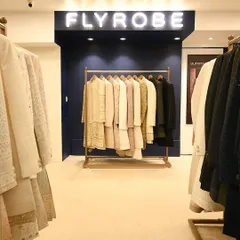 A glimpse inside our well-organized store, with racks of sherwanis and Indo-westerns ready for you to explore.