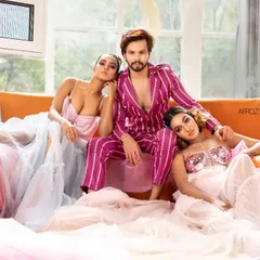 A high-fashion group shot featuring two female models and one male model. I excel at creating powerful group compositions that tell a brand's story, as seen in this promotional image for the Bangalore Couture Edition.