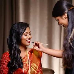 A behind-the-scenes shot of me putting the final touches on my beautiful bride. This was a very special look from two years ago.