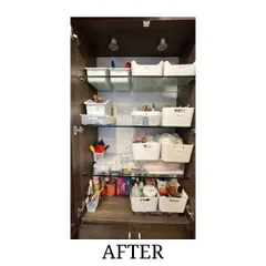 After: The same art supply cabinet, now perfectly organized with white bins. We categorized everything, making the space functional and inspiring.