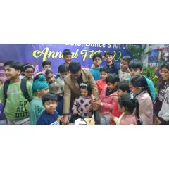 Our founder, Vinit Kumar, joins young students for a cake cutting ceremony during our 27th Annual Solo Fest in 2022. These events are a cherished tradition, bringing our community together to celebrate.