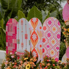 We love playing with patterns. These custom-printed backdrops with retro and block-print inspired floral designs added a unique and vibrant touch to this Haldi event.