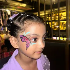 This purple and blue butterfly design is placed beautifully around the eye. Learning proper placement is key to creating face art that complements the face shape, which is something we focus on in the masterclass.