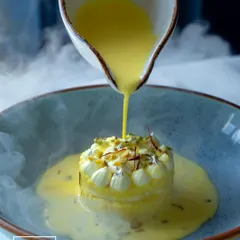 A moment of pure indulgence. Our signature Rasmalai Cheesecake sees creamy cheesecake infused with the delicate flavours of traditional rasmalai, finished with a dramatic pour of saffron milk.