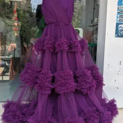 A look at our new purple ruffle gown on a mannequin in our store. This design is also available as a mother-daughter matching set.