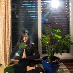Seated in a comfortable cross legged position with my hands in a prayer pose, or Anjali Mudra. This is a moment to introduce the concept of mantras, like the primordial sound OM. These sacred sounds are powerful tools for focusing the mind and preparing for a deeper state of meditation.