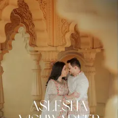 An intimate close-up of the couple, framed by the soft, warm tones of heritage architecture. This highlights their connection amidst the grandeur of the location.