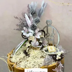 A sophisticated hamper perfect for a wedding anniversary. The silver and white color scheme, complete with a custom "21st" motif, creates a truly elegant and memorable gift.