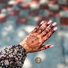 The beautiful, dark stain of a mandala design. The color is rich and even, highlighting the clean lines of the pattern.