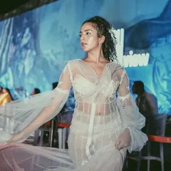 A model showcasing a designer outfit at our URBN Night. We collaborate with fashion designers to integrate live runway shows into the party, creating a dynamic and glamorous atmosphere.