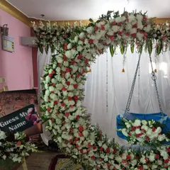 We also add fun, interactive elements to your event. For this naming ceremony, we included a personalized "Guess My Name" photo board for guests to enjoy, making the celebration even more special.