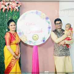 A proud family posing with their newborn and a custom name reveal sign. These signs make for a perfect photo opportunity to cherish forever.