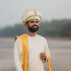 A handsome groom ready for his seaside Maharashtrian wedding. The makeup is completely natural, designed to even out skin tone and control shine for photos, without looking like he's wearing any.