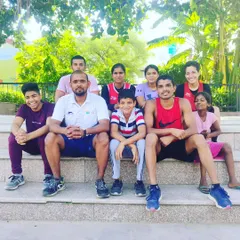 A moment of rest with the team after a tough morning training session. The smiles show the sense of accomplishment and camaraderie we share.