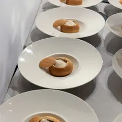 A dish of bread bowls filled with a light mousse, inspired by the "Stack" sculptures of Annie Morris. The spherical shape of the bread directly references the orbs in her artwork.