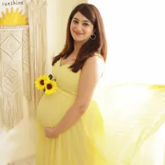 A bright and sunny solo portrait in our Boho studio. The yellow dress, sunflowers, and "Hello Sunshine" decor create a cheerful and optimistic vibe.