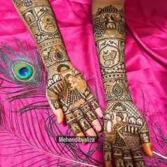 Zoom in to see the love story. This bridal design features a beautiful bride and groom portrait, surrounded by elephants and palanquins, capturing the essence of a grand Indian wedding.