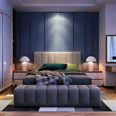 A cozy and modern bedroom design with a deep blue accent wall providing a sense of calm. The room includes a built-in wardrobe with a mirrored panel and an attached dressing table, making it a complete and functional space.