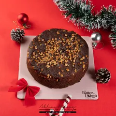 A classic Christmas fruit cake. I used festive props like pine cones, ornaments, and a candy cane to create a warm, holiday atmosphere that instantly says "Christmas."