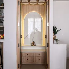 The same puja unit with the integrated backlighting turned on. The warm glow highlights the marble texture and creates a serene and divine ambiance for prayer.