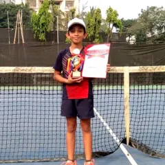 Another one of our promising young talents with his well earned trophy. We are proud to guide our junior players on their path to competitive success.