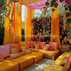 A closer look at the custom seating for this marigold-themed Mehendi. Every detail, from the bolster shades to the cushion covers, was designed in-house to create a cohesive and luxurious feel.