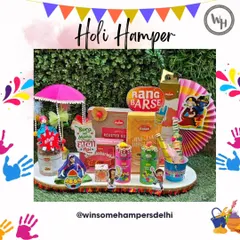 My vibrant Holi hamper is designed for fun, filled with snacks like chips and makhana, along with thandai and buttermilk. The playful decorations, including a "Bura na mano Holi hai" sign, make it a complete festive package.