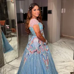 Unveiling a vibrant carnival sangeet look! The makeup features a pop of color and a flawless base to match the fun and festive energy of her beautiful blue and pink lehenga.