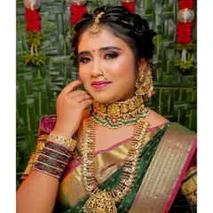 A close-up of a classic South Indian Muhurtham makeup look. I focus on enhancing your features to create a radiant and timeless appearance that complements the heavy temple jewelry and silk saree.