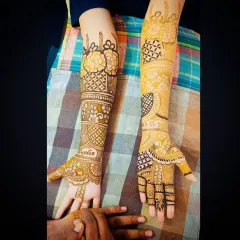 A view of the personalized bridal mehandi showing the groom's name 'Fardin' and the wedding date.