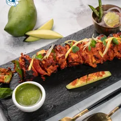 Our Mango Paneer Tikka is a star vegetarian appetizer, combining the smokiness of the tandoor with the sweetness of fresh mango.