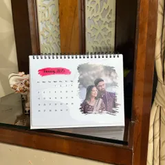 A different angle of the spiral-bound photo calendar, showing how it stands neatly on a shelf. It’s a practical and heartfelt gift for the new year.