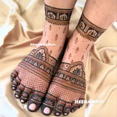 A full-coverage bridal foot mehendi with intricate checkerboard patterns and a beautiful lotus border around the ankle.