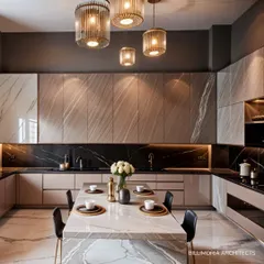 An expansive U-shaped kitchen with a large central island that serves as a dining table. The design features a mix of light and dark marble, creating a sophisticated and cohesive look, all illuminated by elegant pendant lights.
