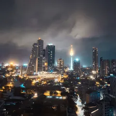 A moody, atmospheric shot of the Colombo skyline at night. Using my iPhone, I captured the city lights under a dramatic, cloudy sky, demonstrating my skills in mobile photography and low-light shooting.