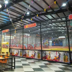 A view of our expansive play area from the dining section. The open layout allows parents to keep an eye on the kids while they relax and socialize.