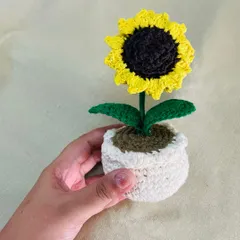 Another angle of the crochet sunflower pot, showing the texture of the hand-stitched petals and leaves. Each one is made with love and attention to detail.