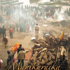 An overhead view of Manikarnika Ghat, showing the constant activity of funeral pyres and grieving families. The image, titled 'The burning ghat of Varanasi', serves as an introduction to this profound place.