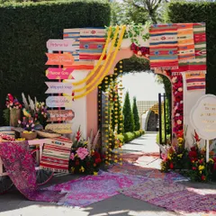 The entrance to our Souk-themed Haldi in Ooty. We used colorful rugs, dhurries, and signages to create an authentic bazaar feel right from the start.
